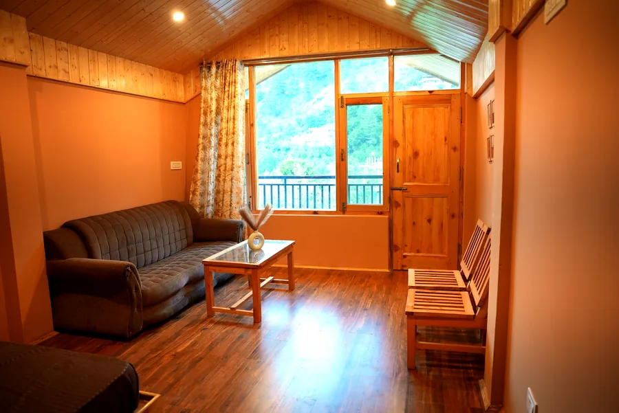 Living area with sofa and mountain view window
