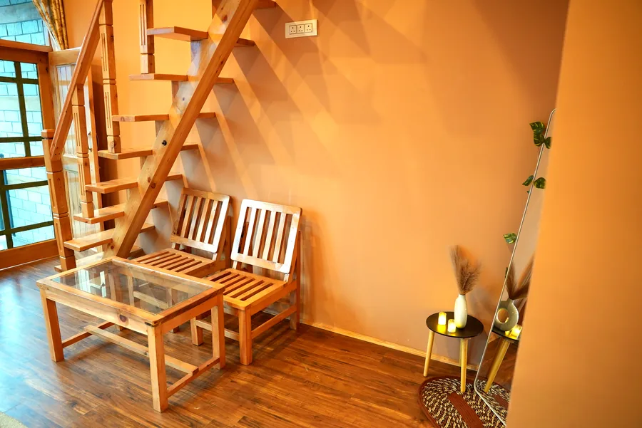 Wooden staircase nook with candles and decor