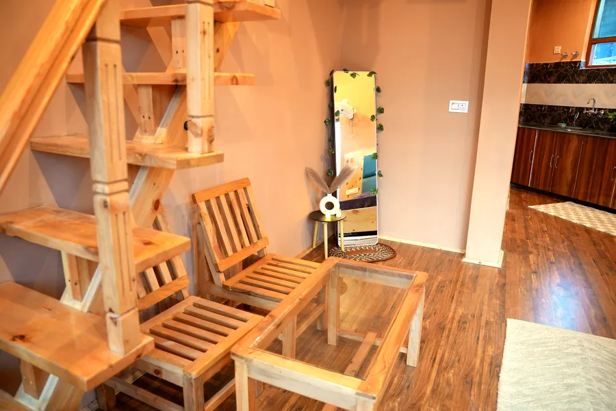 Duplex staircase nook with kitchen visible
