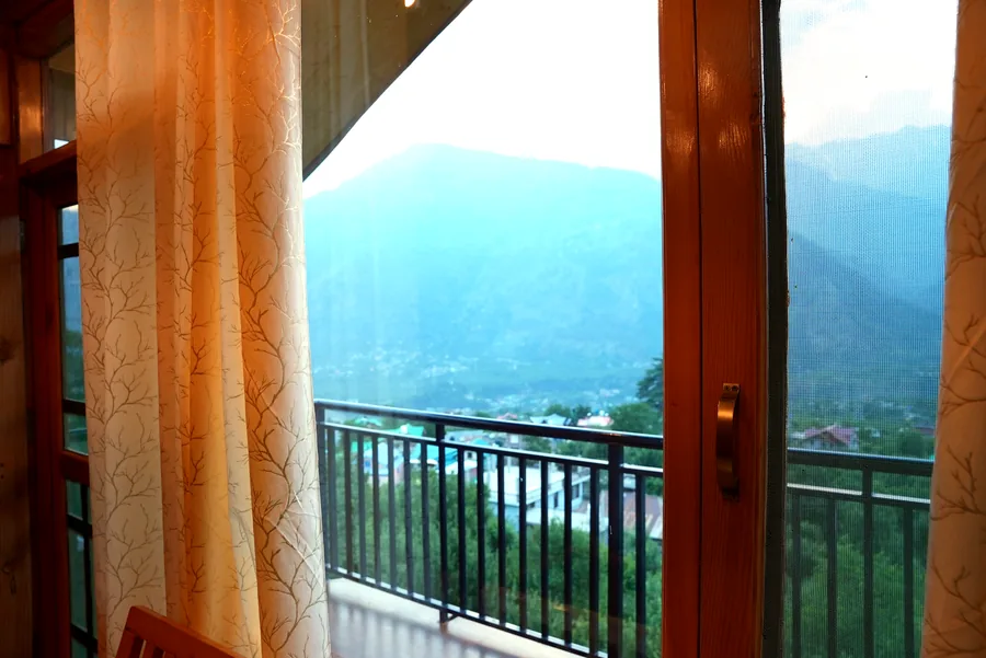 Window view of Kullu mountain range from room