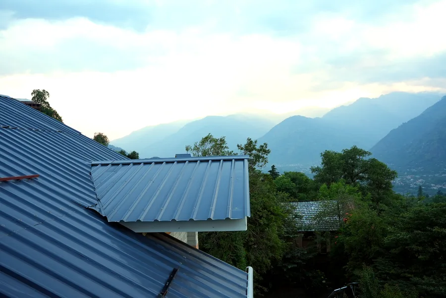 Evening mountain sky and rooftops near Naggar