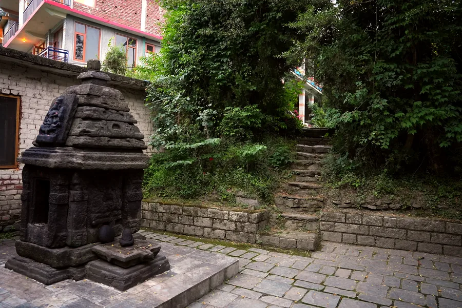 Stone shrine and garden pathway at Ghar in the Hills